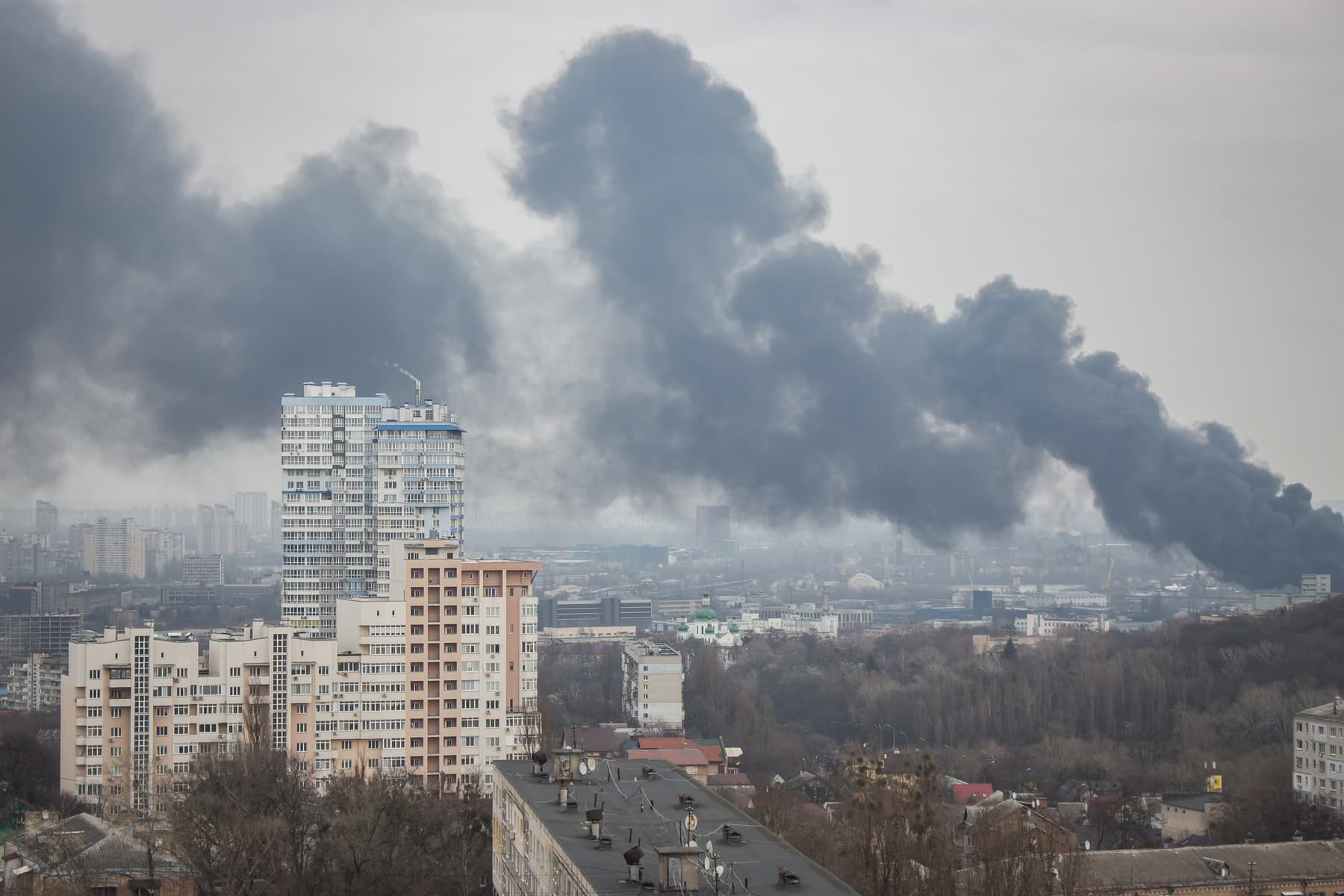 Kiyv, Ukraine skyline with smoke after missile strike.