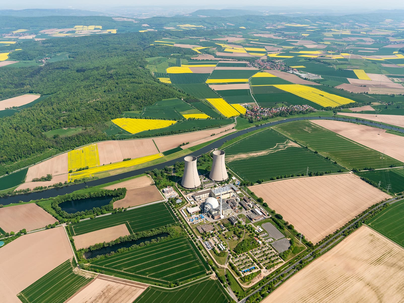 aerial view of a nuclear power plant cooling towers and surrounding area