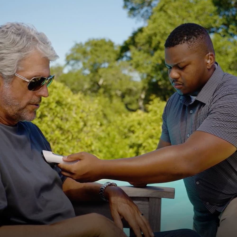 personal protection officer checking vitals on a client personal protection officer checking vitals on a client