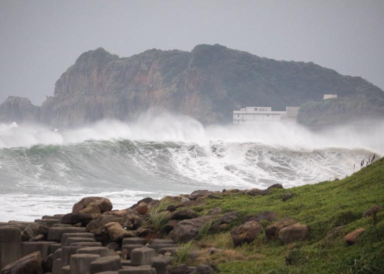 Waves crash on the shore ahead of Typhoon Khanun.